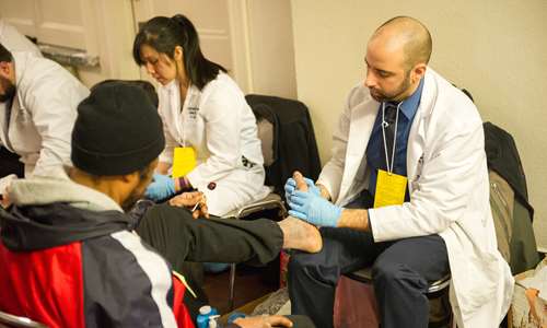 Podiatry residents share care and a compassionate ear at annual Homeless Stand Down